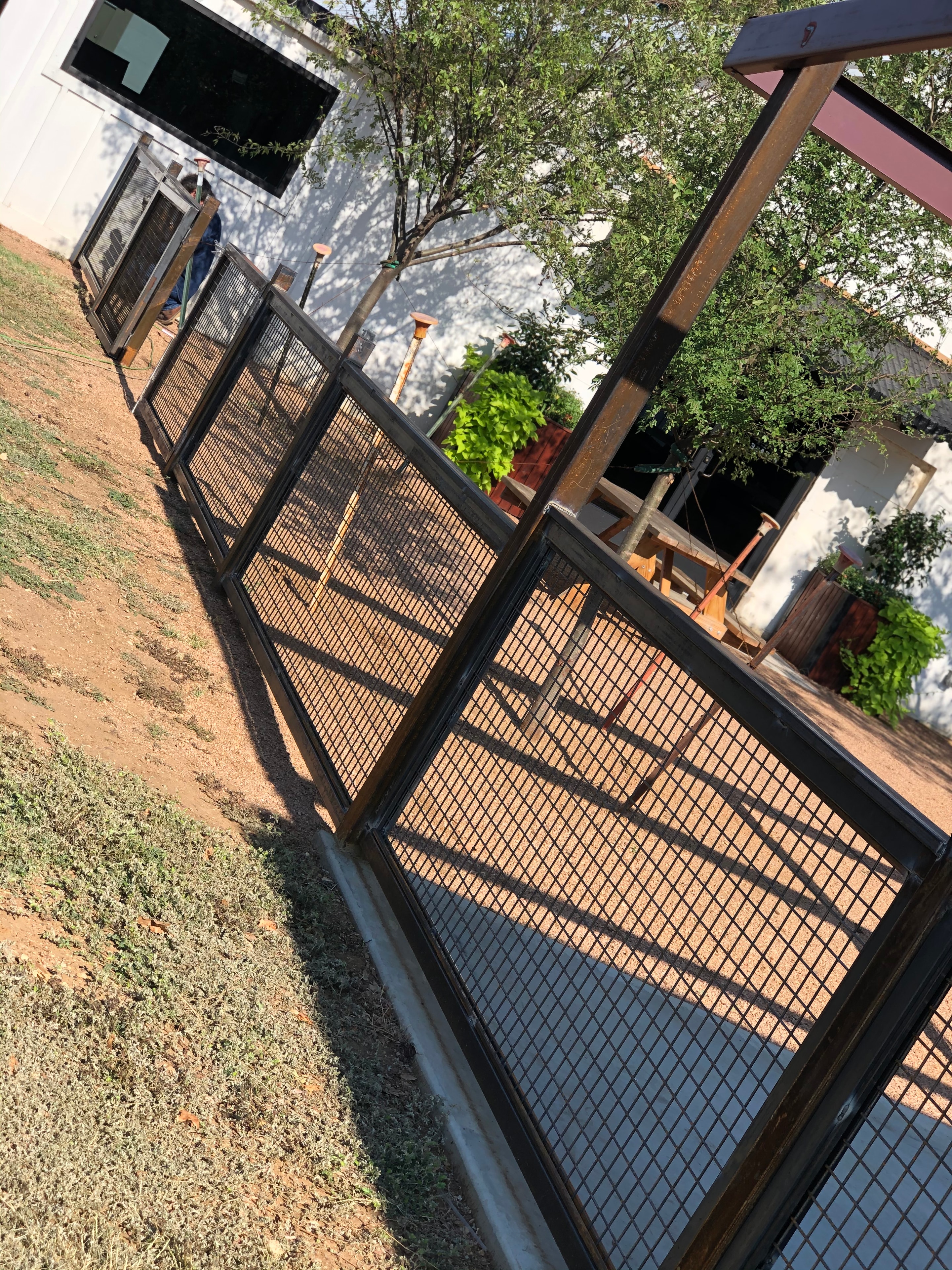 Custom metal gate at rural property entrance